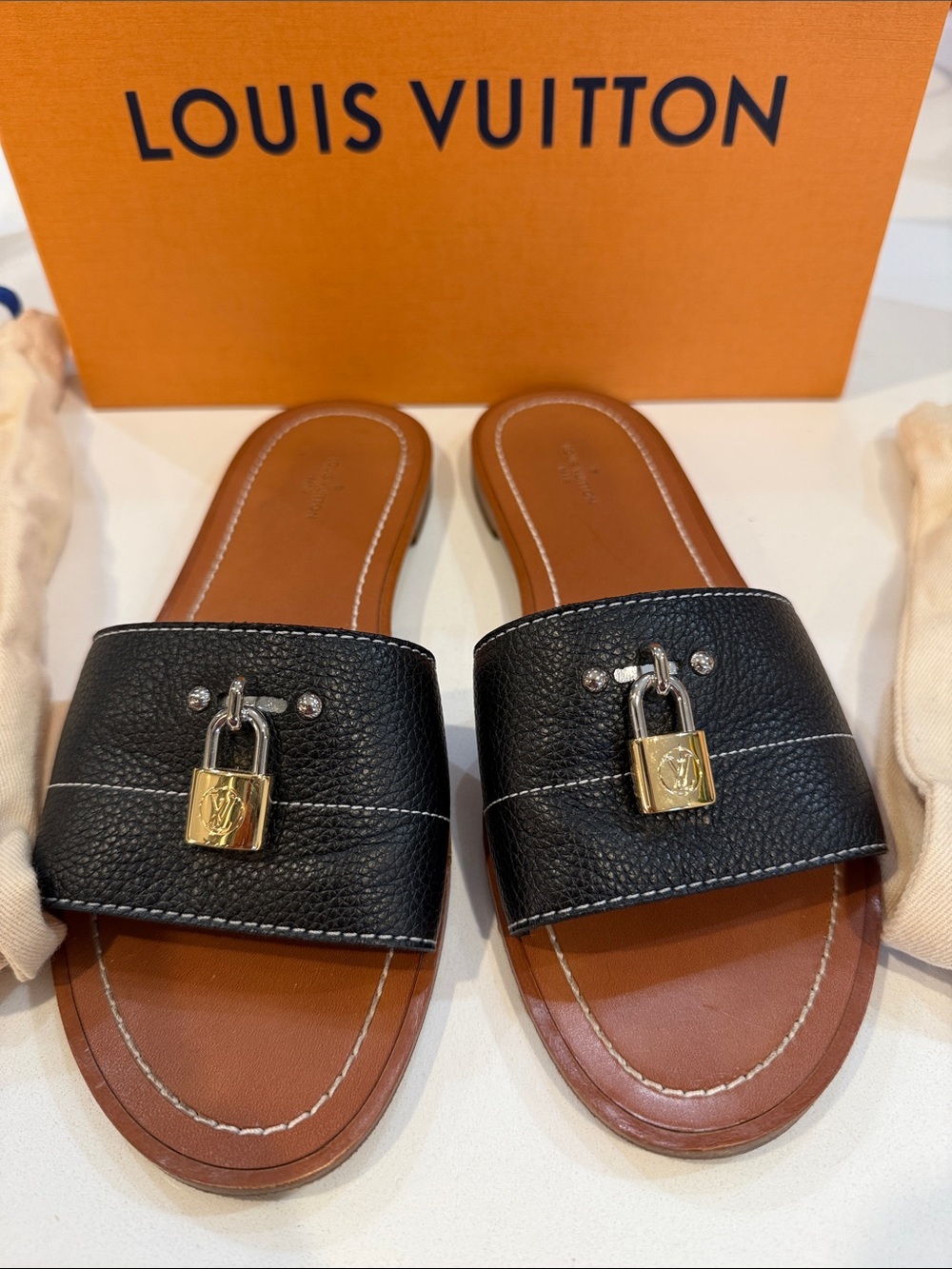 Louis Vuitton Black Grained Leather Lock It Flat Mules Sandals | Size 38